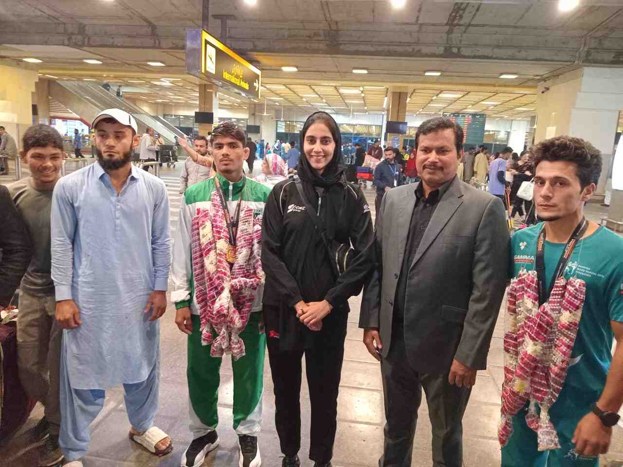 Great Welcome for Pakistan’s MMA Stars at Karachi Airport